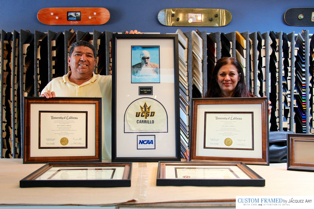Proud Parents picking up all four custom framed diplomas for their 4 kids.