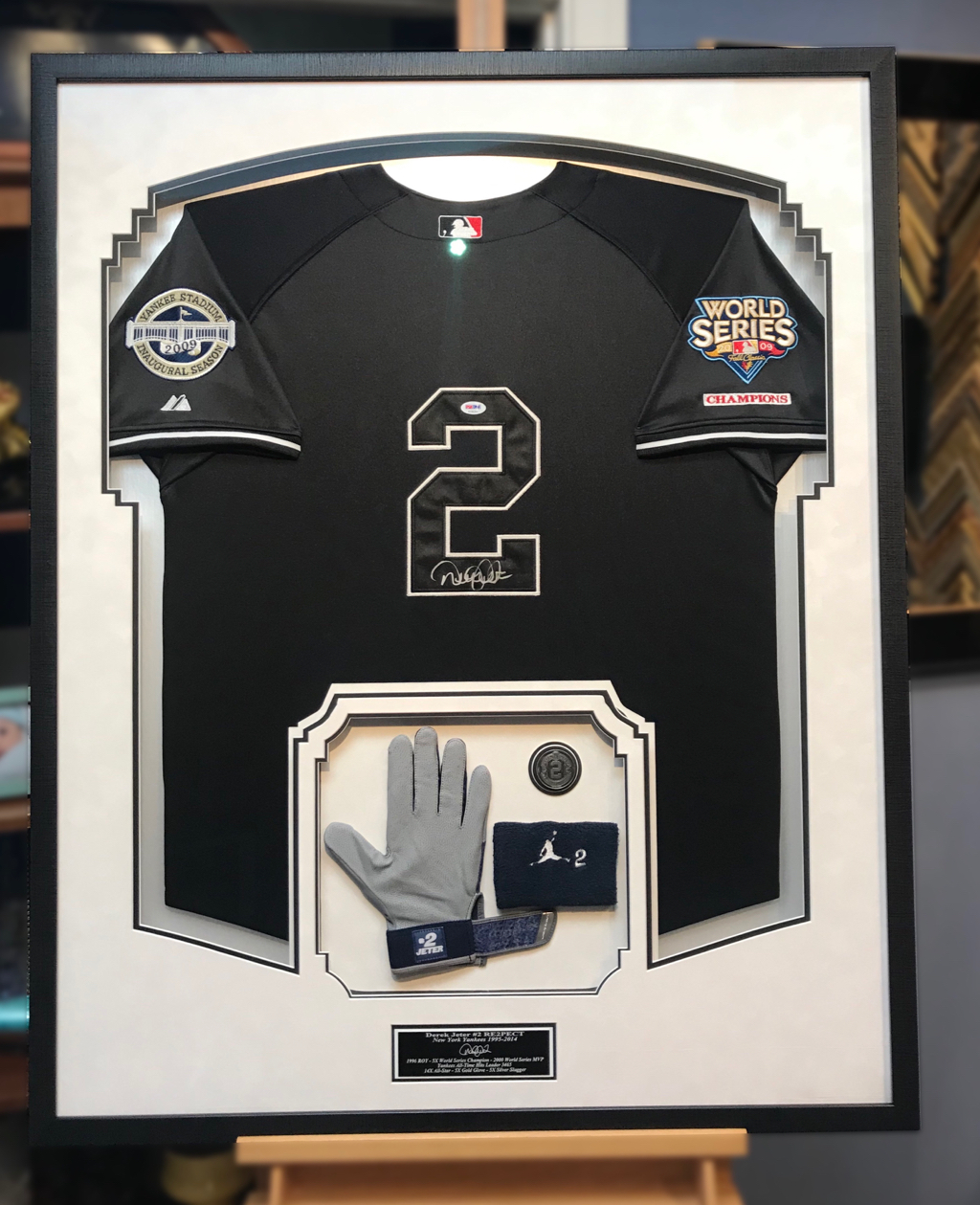 Rare Derek Jeter, Yankees, Black signed Jersey with ROY glove, wristband and coin Jersey Framing